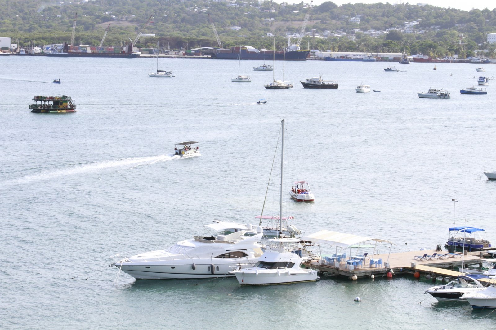 Boats anchored Colombia Caribbean island turquoise water day trip