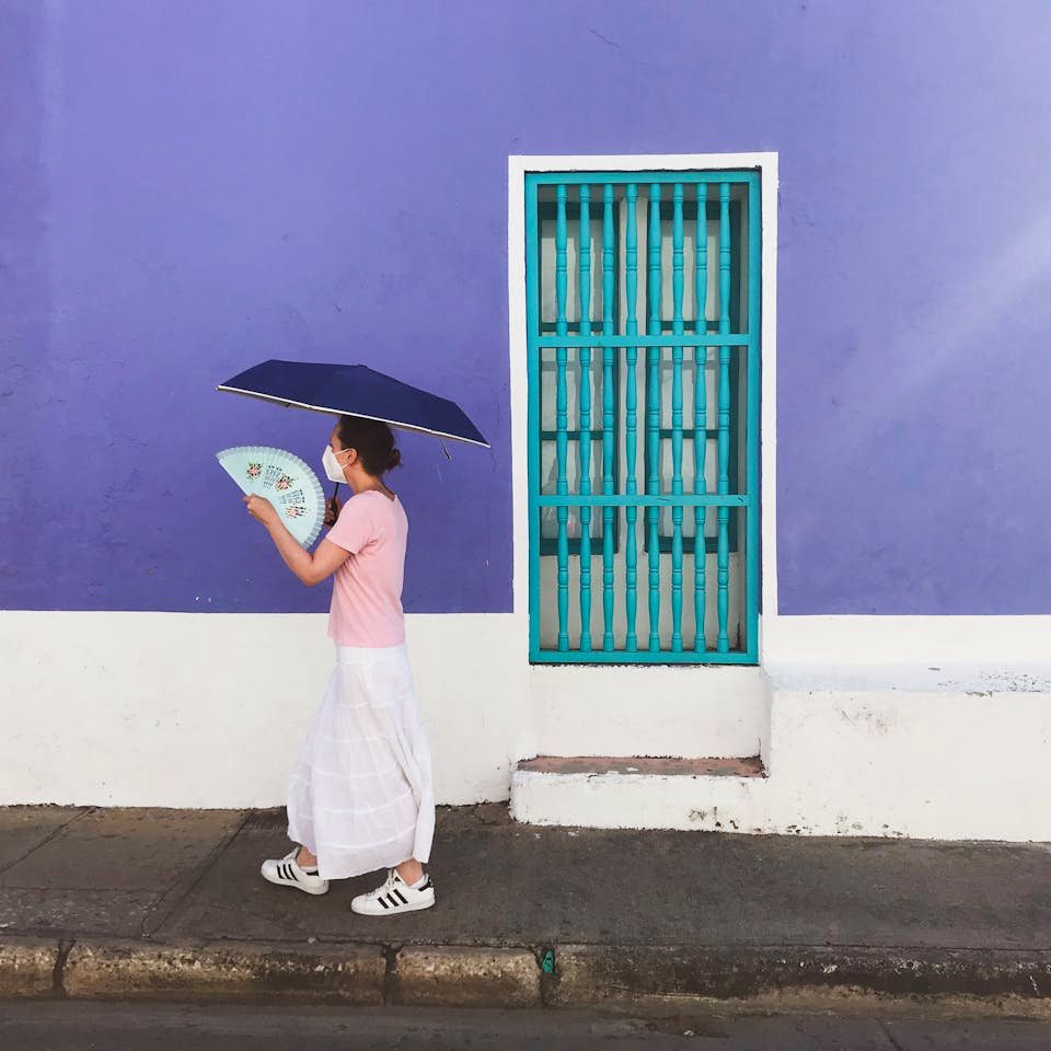 Tourist walking safely in Cartagena Colombia street palenquera