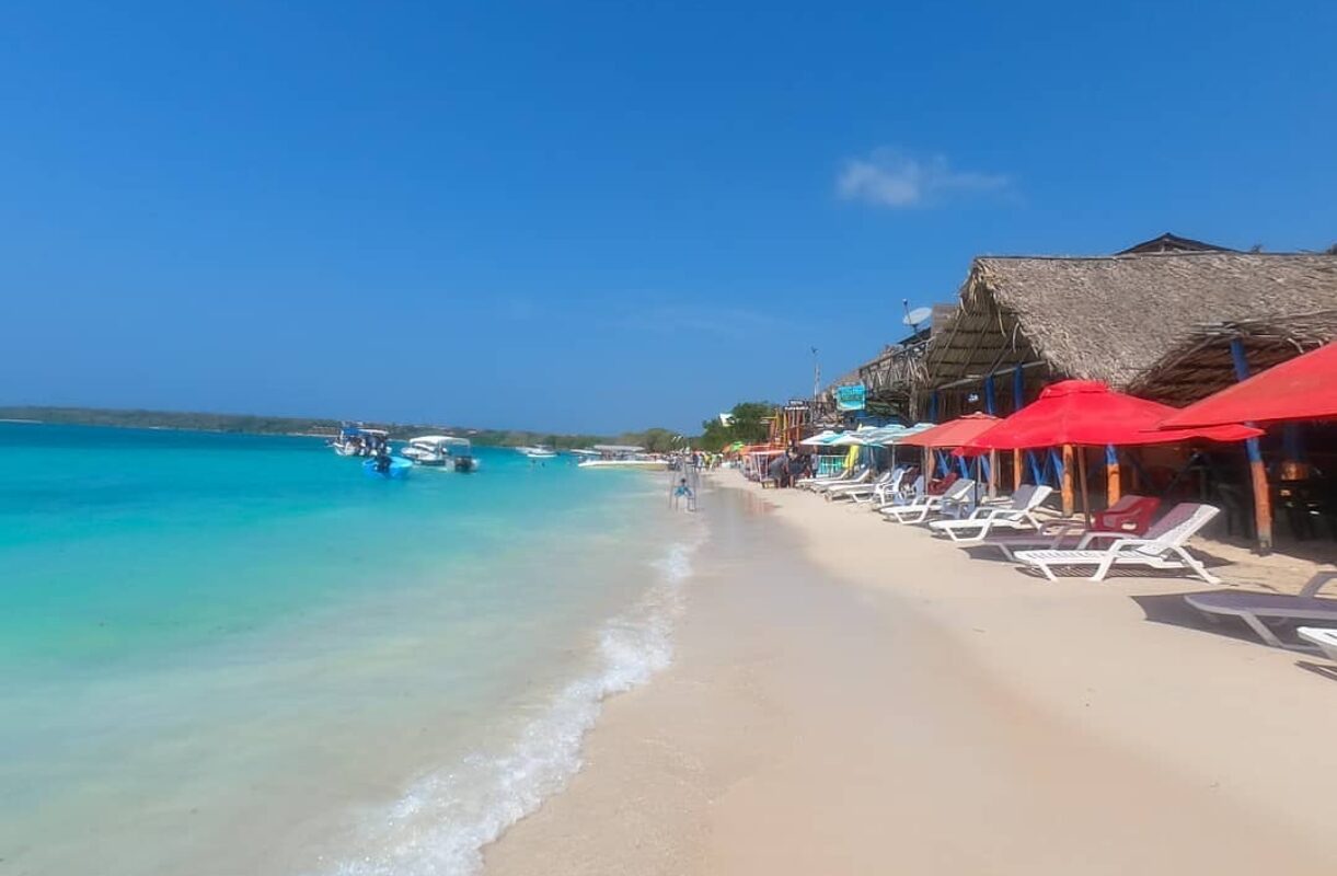 Empty white sand and turquoise water at Playa Blanca, Baru, early morning before the day-trip boats arrive