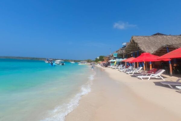 Empty white sand and turquoise water at Playa Blanca, Baru, early morning before the day-trip boats arrive