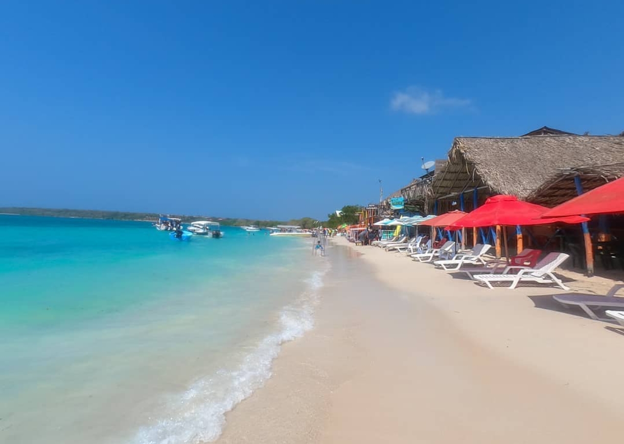 Empty white sand and turquoise water at Playa Blanca, Baru, early morning before the day-trip boats arrive